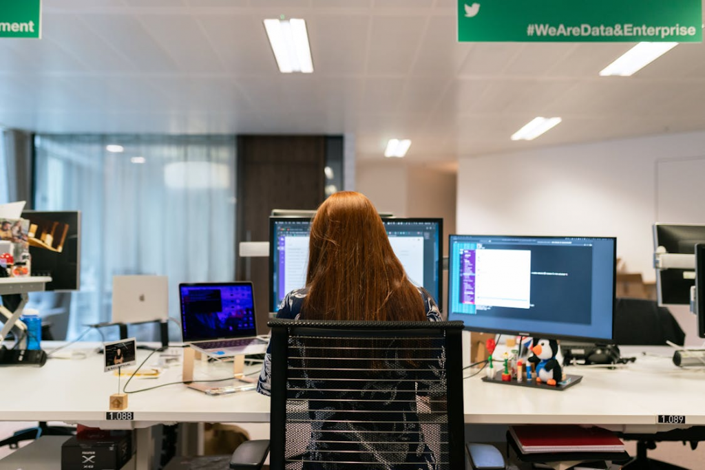a woman with red hair on her work desk.