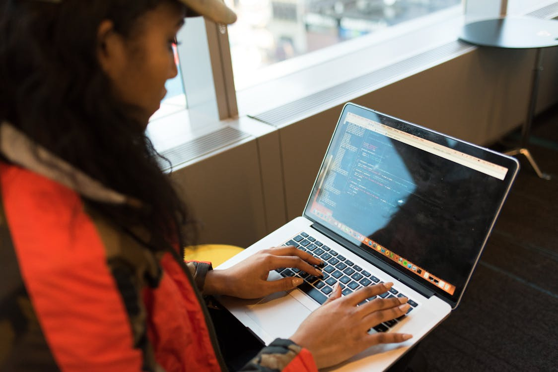 a woman looking at her computer screen.